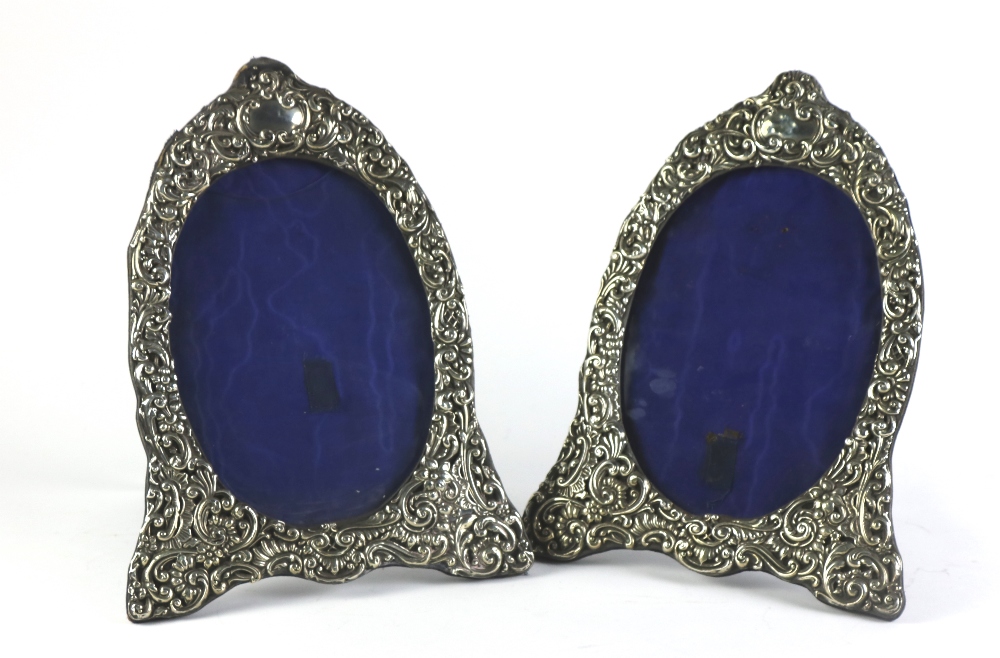 An attractive pair of late Victorian English silver Table Mirrors,