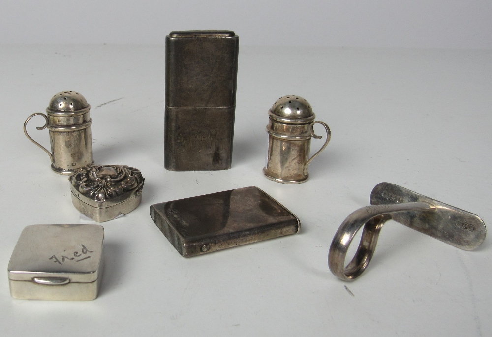 A heavy silver Cigarette Lighter, a small Victorian silver Vesta Case, inscribed "Angus Club,