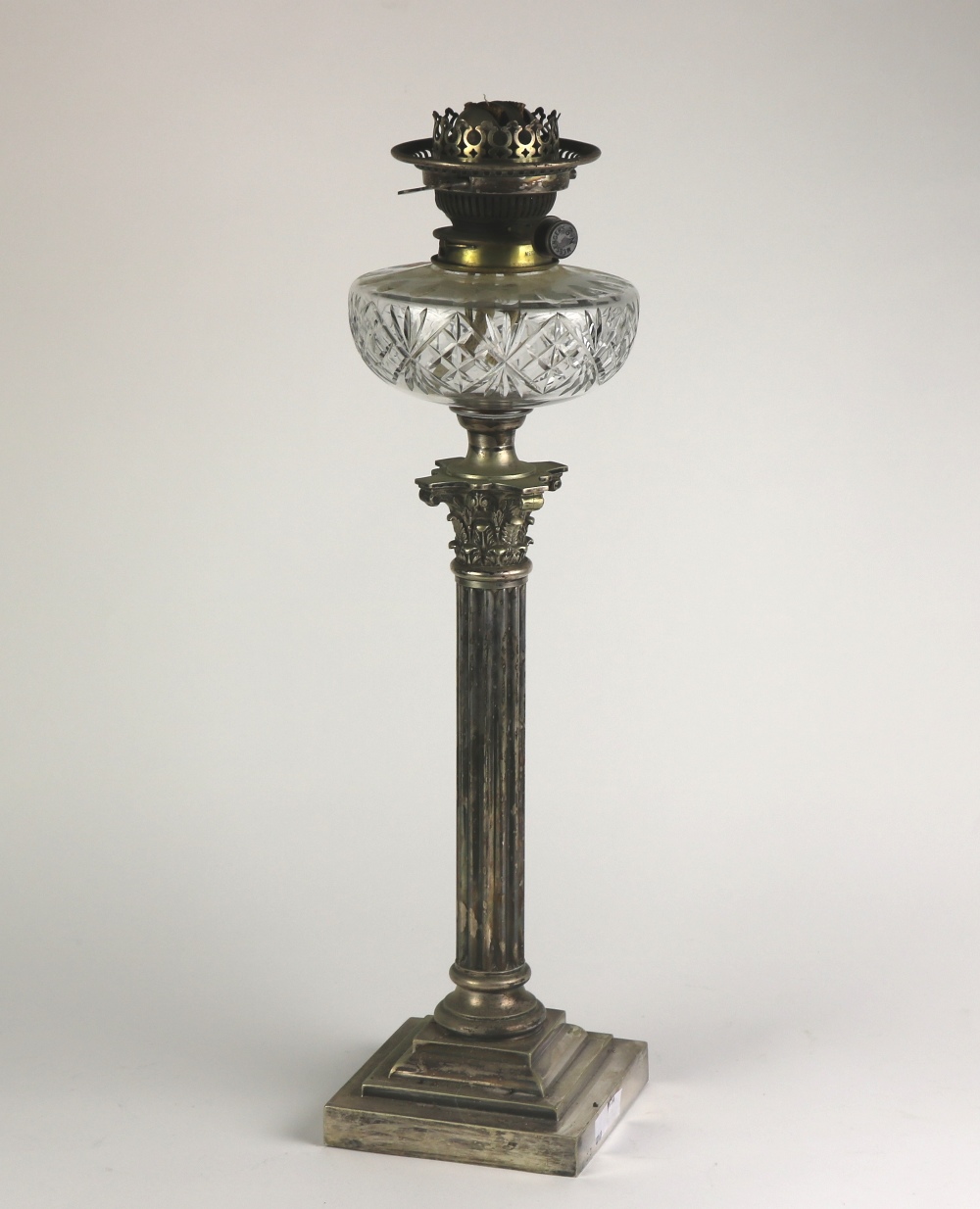 A tall 19th Century silver plated Table Lamp, in the Corinthian style with cutglass bowl,