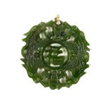 An attractive 19th Century carved and pierced jade 'Dragon' Pendant,