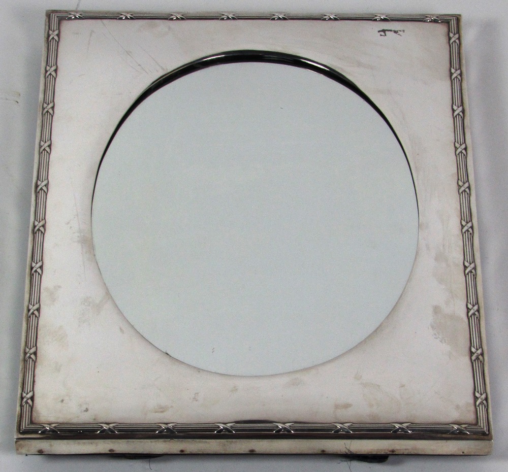 A very attractive oval silver Table Mirror, by William Comyns, London 1902, with rectangular frame,