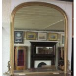 A plain Victorian style giltwood Overmantel, with arched top and a base with carved corbels, approx.