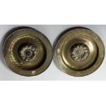 An important similar pair of early German brass Alms Dishes, 17th Century or earlier,