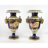 A pair of attractive "Sevres" type blue ground painted Vases, with shaped rim,