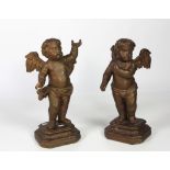 A pair of late 18th Century / early 19th Century carved giltwood Cherubs, approx. 50cms (19") high.