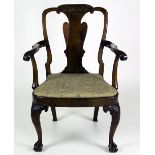 A good quality George III walnut Armchair, with carved slat back,