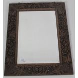 An attractive Arts & Crafts period upright oak Wall Mirror,