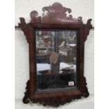 A small George III period fret-cut Wall Mirror, with shaped frame around rectangular mirror plate,