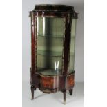 An attractive kingswood marquetry and ormolu mounted Vitrine,
