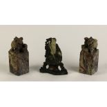 A pair of attractive Soapstone Figures, modelled as lions on tall square bases,