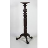 A 19th Century carved mahogany Torchere,