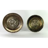 An early German brass Alms Dish, the centre decorated with scene of Adam and Eve in the Garden,