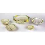 An attractive collection of five varied sized floral encrusted and pierced decorated Belleek