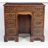 A 19th Century mahogany kneehole Bachelors Chest,