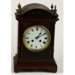 A small attractive carved Edwardian walnut Mantle Clock decorated in the Adams style,