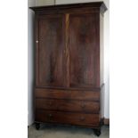 A large Irish Georgian mahogany Linen Press, the moulded cornice over two figured mahogany doors,