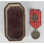 A rare Napoleon III silver Medal, after Barre with original miniature, and red striped ribbon,