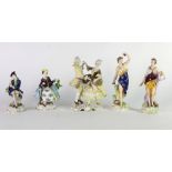 A pair of Crown Derby porcelain female Figures, with colourful decoration highlighted in gilt,