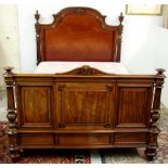 A William IV mahogany 4' Bed, with shaped and carved headrest with pillar supports on turned feet.