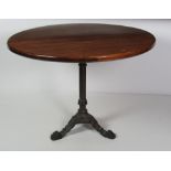 A large circular Breakfast Table, on stained pine top with earlier metal tripod base, approx.