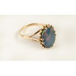 An attractive 9ct gold Ring, with a large oval shaped opal stone inset, hall marked.