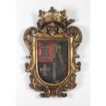 An attractive late 17th Century Spanish carved giltwood and polychrome painted Coat of Arms,