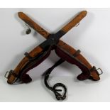 An old leather and oak frame X shaped Horse Training Frame.