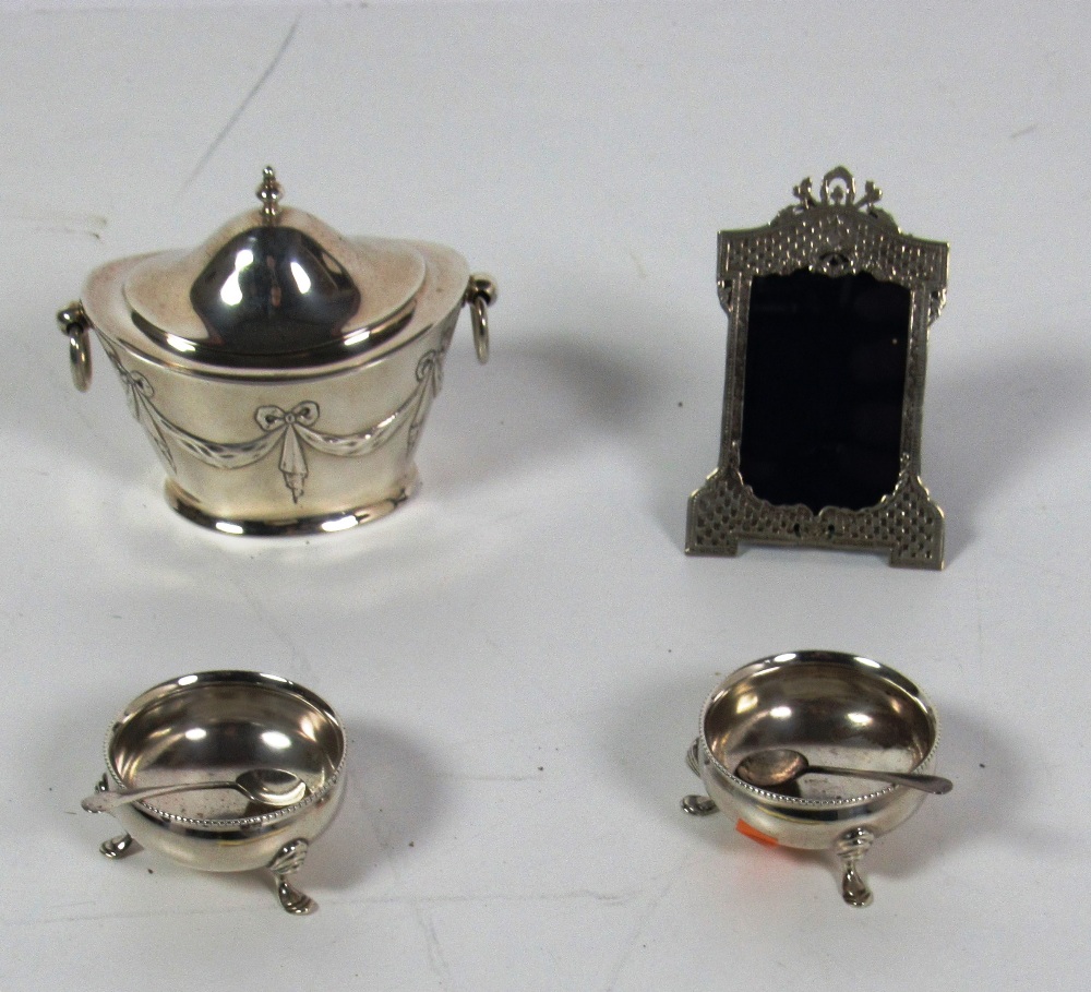 An attractive small English silver Tea Caddy, decorated in the Adams style two ring handles,