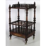 A Victorian walnut inlaid two tier Canterbury, with fret work gallery,