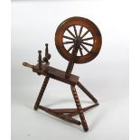 An oak Spinning Wheel.
