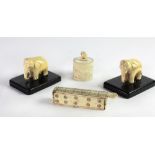 A fine pair of small 19th Century carved ivory Elephants, mounted on ebony stands,