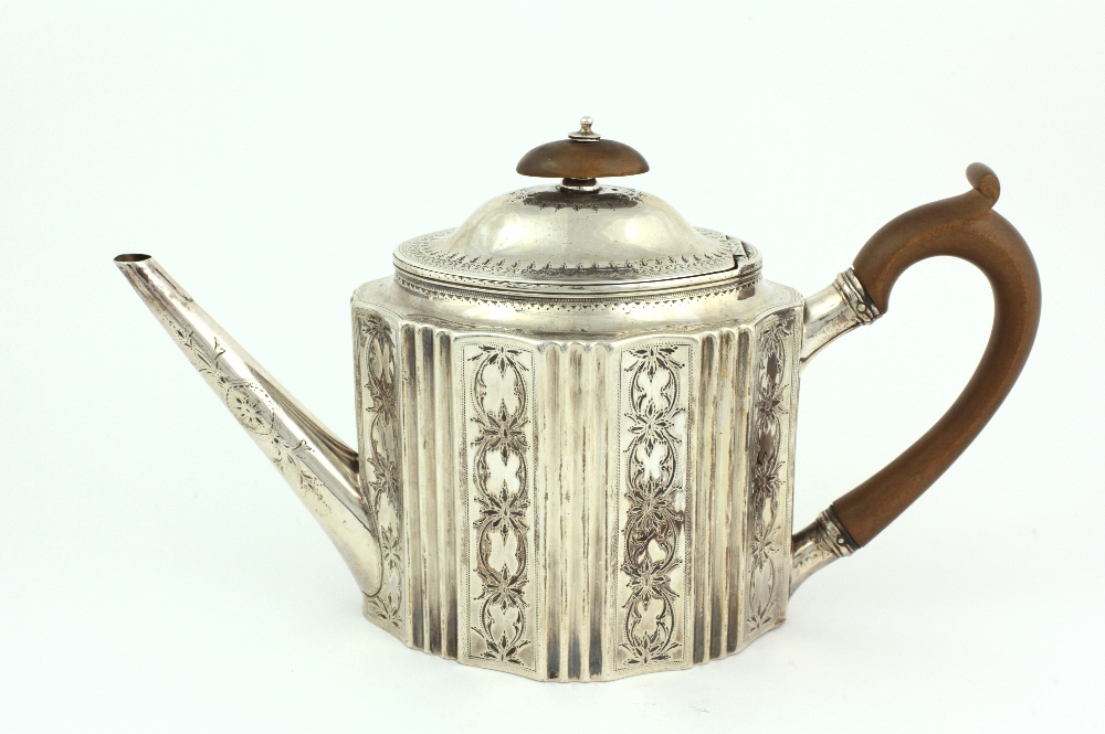 An attractive English George III shaped oval bright cut silver Teapot, London c. 1809, by R.H.