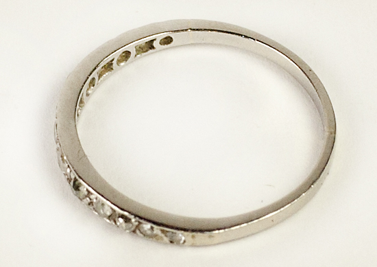 A platinum Eternity Ring, set with 13 graduating diamonds.