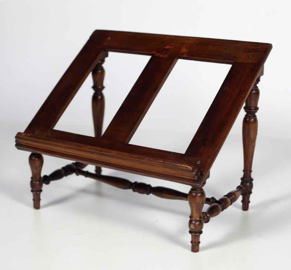 A 19th Century mahogany Bookstand, on turned supports.