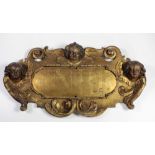 A good quality 18th Century carved heavy giltwood overhead Panel, inscribed I.N.R.I.