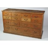 A good quality and unusual oak Chest, of eight short and four long drawers,