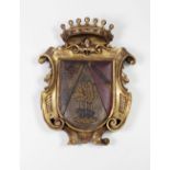 A fine quality Spanish carved giltwood and painted Coat of Arms, probably 17th Century,