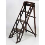An attractive Victorian wooden Step Ladder, "The Natherley Pattent Lattistep," used as a bookshelf,