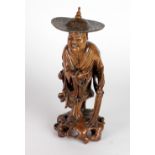 A very good 19th Century Japanese carved boxwood Figure, of a Street Vendor, approx.