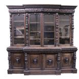 A good quality 19th Century profusely carved oak Breakfront Bookcase,