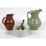 A large white porcelain Mortar & Pestle, a large green porcelain Carleton Ware Jug,