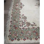 A large and attractive cream ground heavy pile Donegal Carpet,