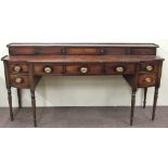 A Georgian period mahogany breakfront Sideboard, Scottish, with gallery back over sliding doors,