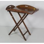 A 19th Century Irish oak brass bound Butlers Tray on stand, with folding flaps.