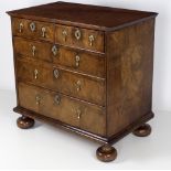 A good early 18th Century finely figured walnut veneered Chest, of two short and three long drawers,