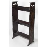 An Art Nouveau three tier trough type free standing oak Bookcase,