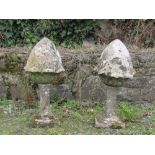 A pair of 18th Century granite Pillar Caps and Stands, modelled as acorns, each approx.