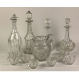 Glassware: A collection of varied Glass including a Jug, four varying Decanters and Stoppers,