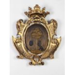 A good late 17th Century, early 18th Century Spanish carved giltwood and painted Coat of Arms,