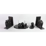 A pair of carved ebony Elephant Book Rests, an ebony elephant Desk Companion,